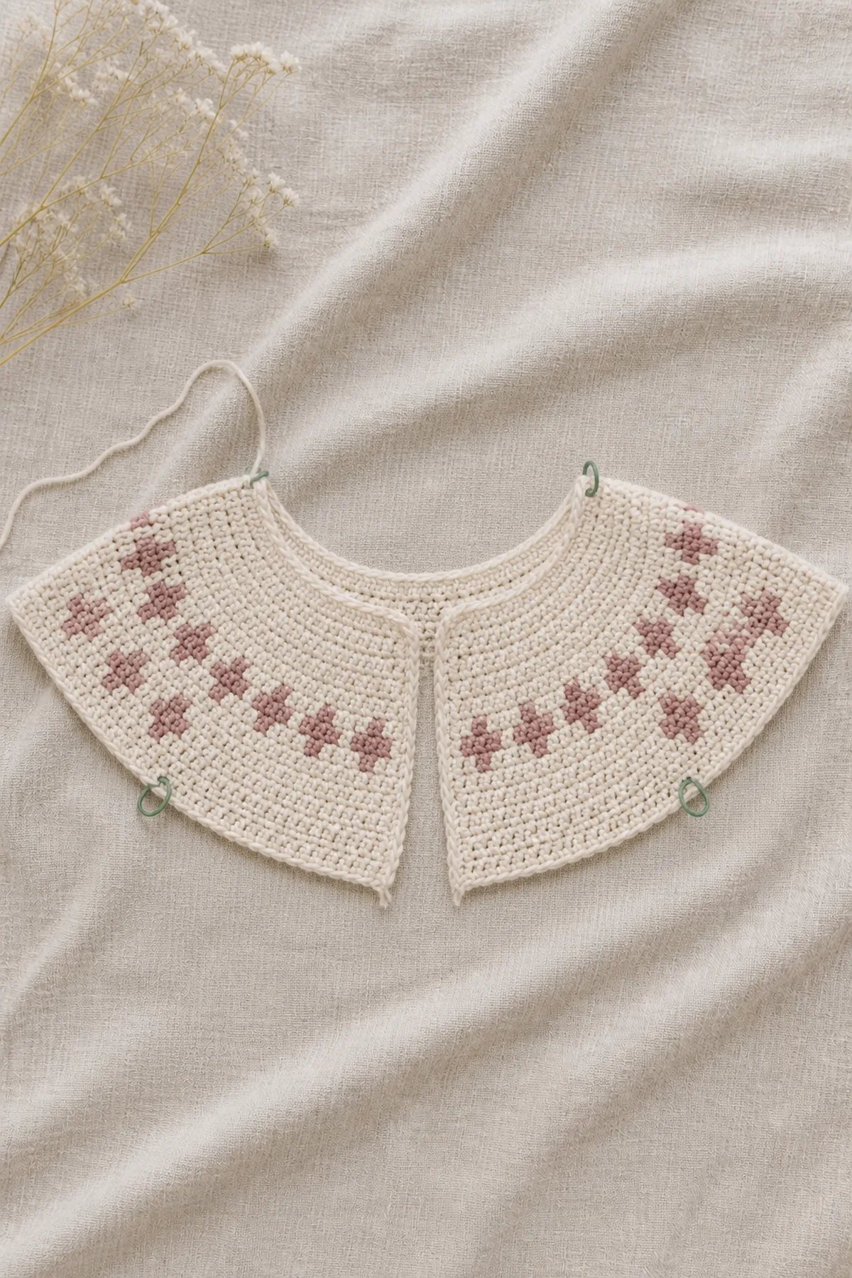 Early counted crochet stage of dahlia - children’s cardigan with matching yarn and hook