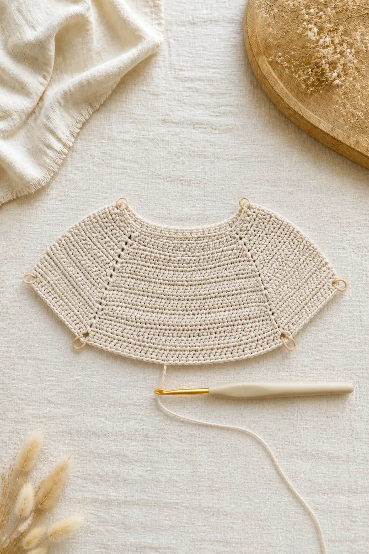 Early counted crochet stage of horizon - children’s cardigan with matching yarn and hook