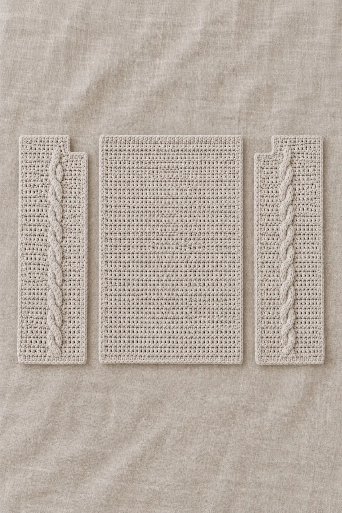 Pale stone plain dc back and two mirrored stepped-neck fronts each with one narrow cable column, unjoined panels