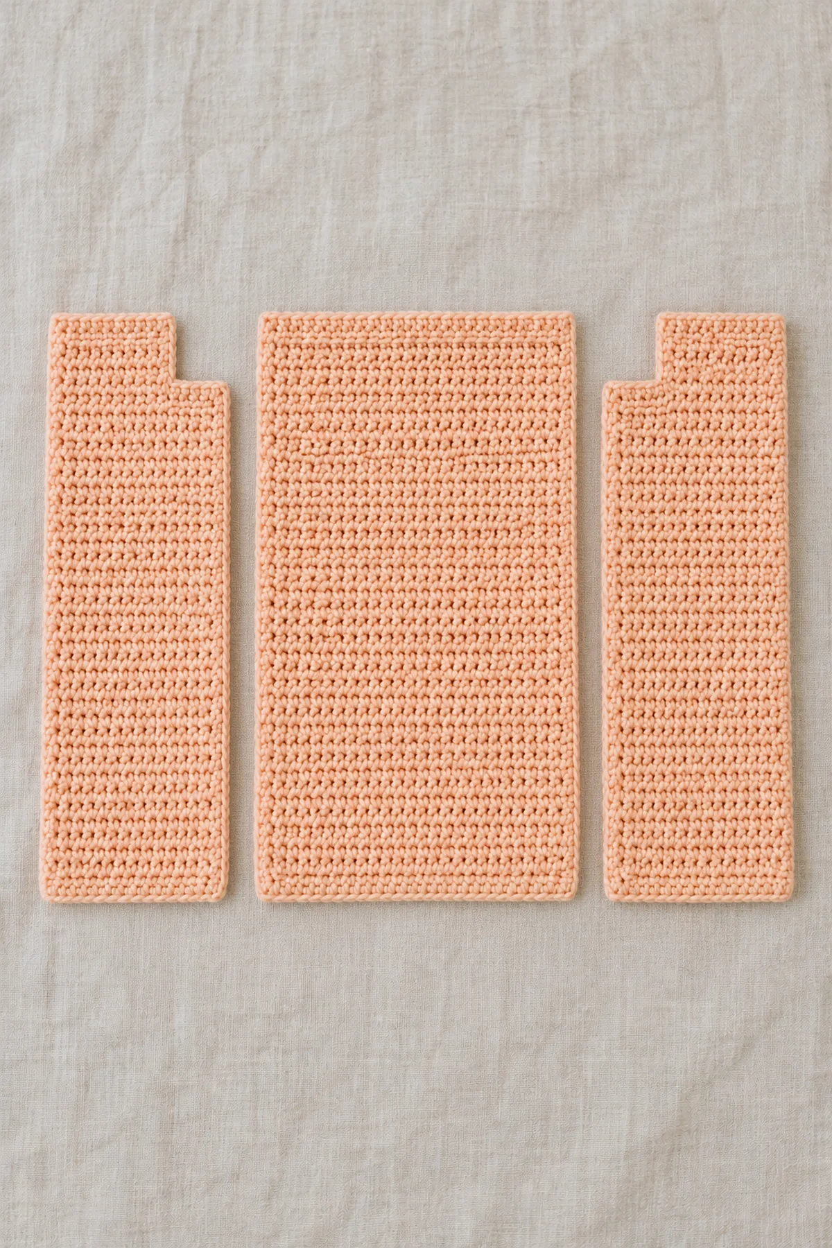 Unjoined soft apricot plain sc back and mirrored stepped-neck front panels with no sleeves attached