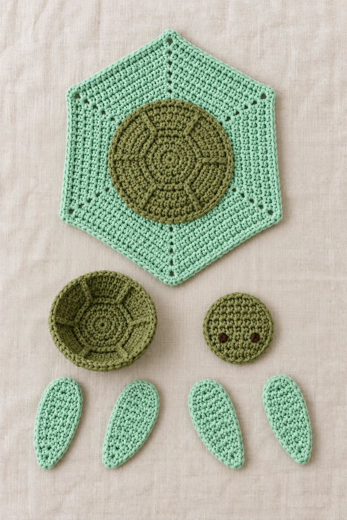 Completed mint 24-round hexagonal cloth beside separate low olive crochet shell cup, one flat olive head and four tapered mint flippers, all unattached on linen.